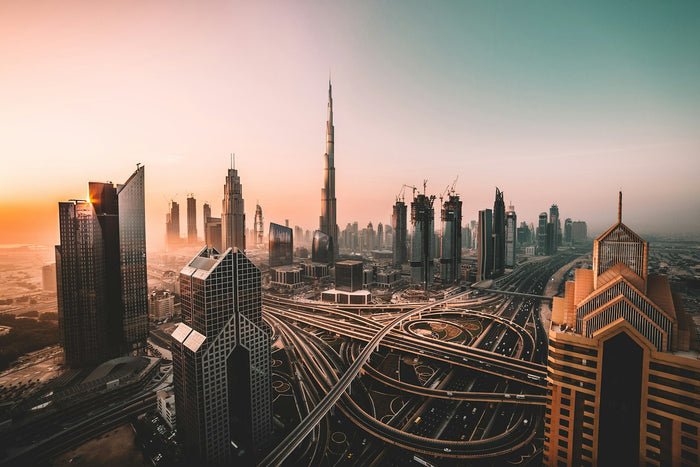 Dubai skyline with Burj Khalifa above a busy highway interchange