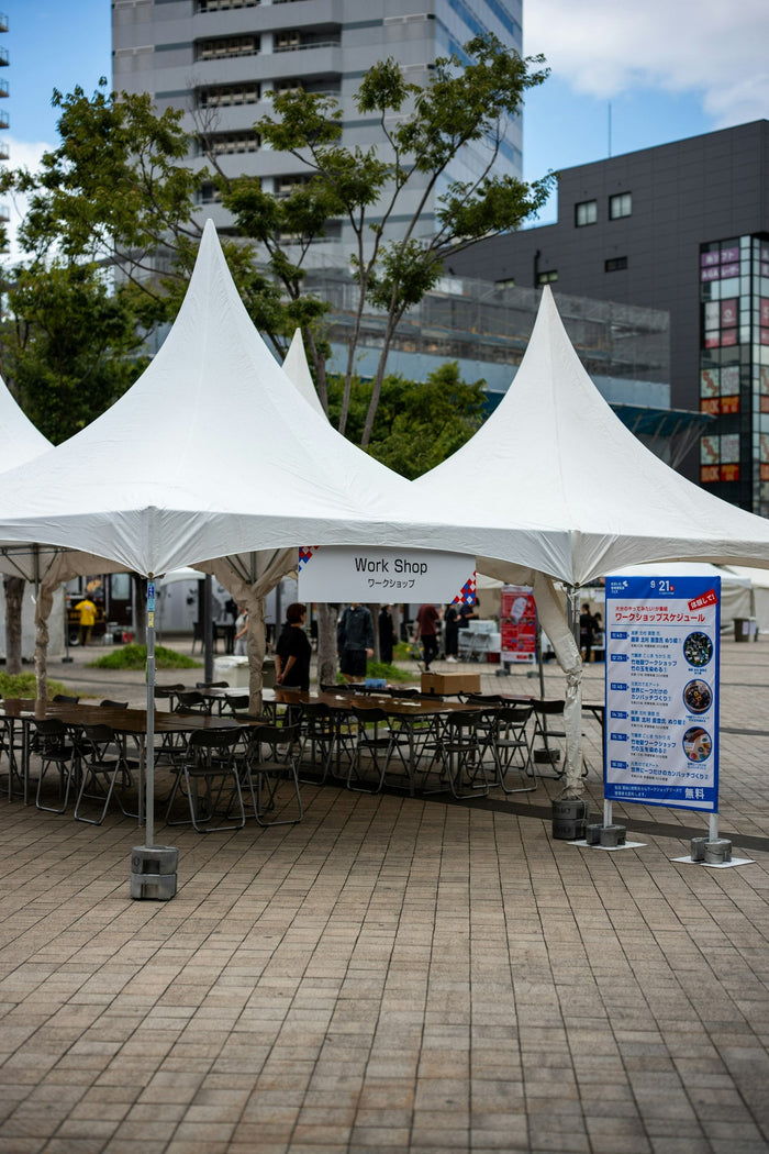 White tents set up for an outdoor event, the kind of site where Starlink provides temporary internet in the UAE