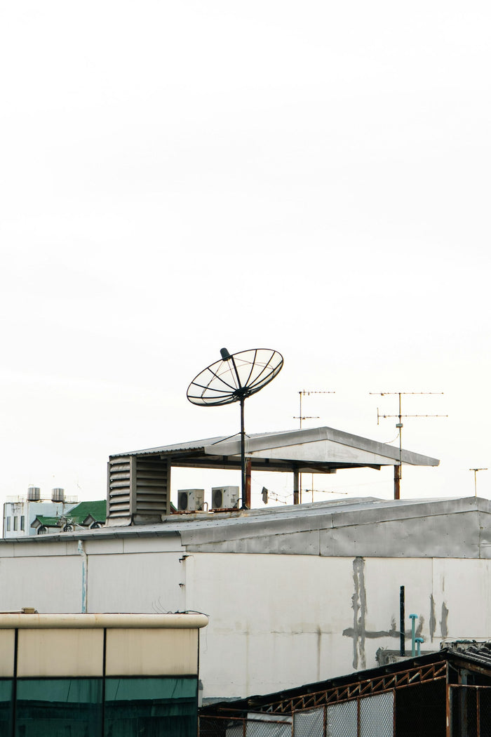 Satellite dish on a city rooftop, Starlink plans explained for the UAE