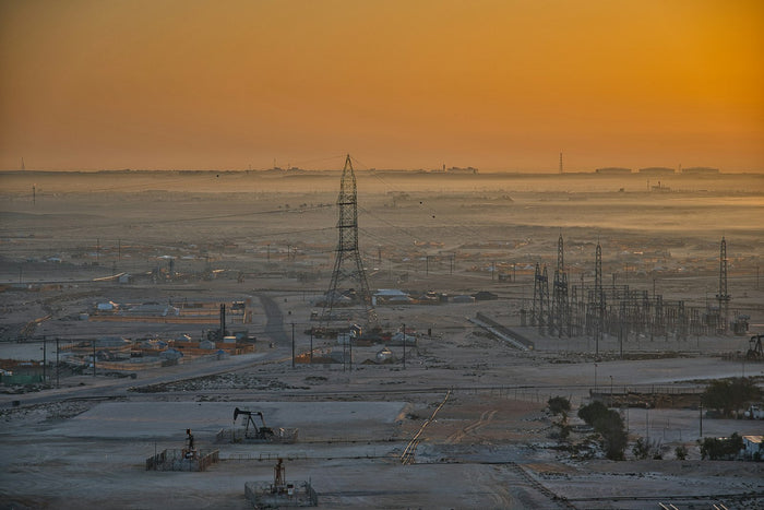 Oil field pumpjacks in the desert at sunrise, Starlink for remote sites and camps in the UAE