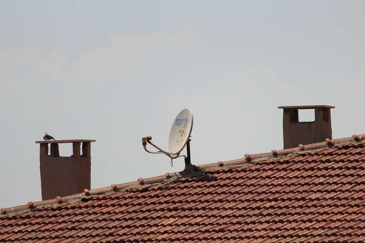 Satellite dish mounted on a tiled roof, Starlink mounts and accessories in the UAE
